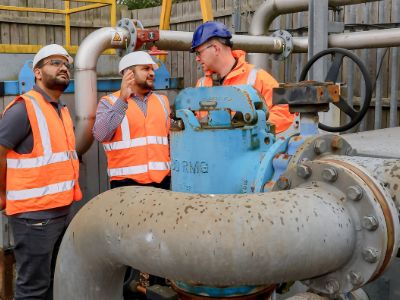 PhD student Rana Faisal Shahzad and Dr Shahid Rasul discussing a CO2 recycling project with Dan Ferguson of SUEZ recycling and recovery UK, at the SUEZ plant in North Tyneside.