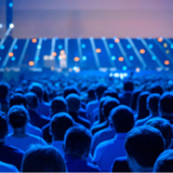 a crowd of people in a dark room