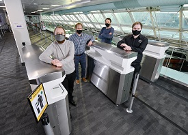 Pictured left to right are Kieran Dougan, Simon Scott-Harden and Howard Fenwick of Northumbria University, and Andrew Sambell of British Engines, with the FLO-SAN hand sanitisation unit at Newcastle Airport