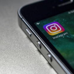 image of a mobile phone with the instagram app logo on the screen