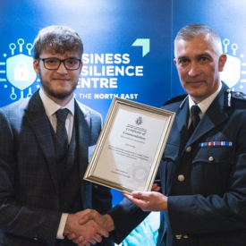Jack Gooday with the Chief Constable of Humberside Police receivng an award.