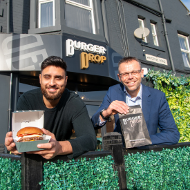 Hasan Hamid and Graham Baty outside of Burger Drop on Westgate road.