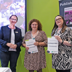 General Secretary of the Microbiology Society, Professor Karen Robinson, presents Dr Helen Hooper and Dr Amanda Jones from Northumbria University with the 2024 Microbiology Society Outreach Prize.