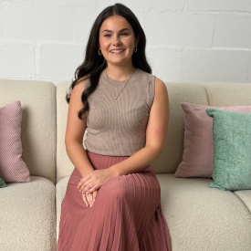 Imogen Russell sitting on a sofa