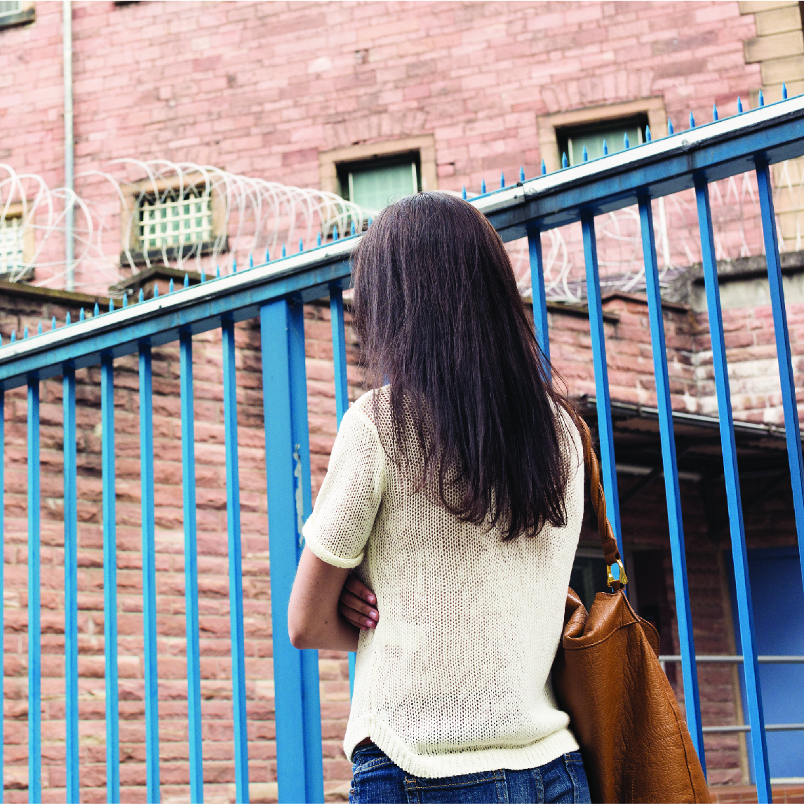 Woman looking at prison