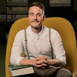 Jack Parker sitting in a chair