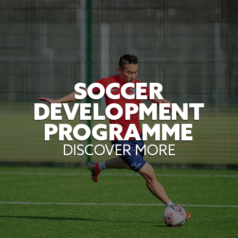 Image: i2i student-athlete kicking a ball. Text: "Soccer Development Programme - Discover More"
