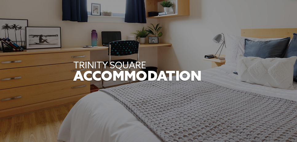 Image: interior of one of the Trinity Square bedrooms. Text: "Trinity Square - Accommodation"