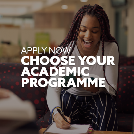 Image: female student sat in a study area, smiling as she makes notes. Text: "Apply now - choose your academic programme"