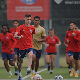 Image: group of i2i student athletes, male and female, training at Coach Lane Campus.