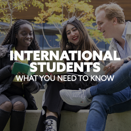 Image: three students gathered around a laptop. Text: "International Students. What you need to know."