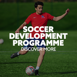 Image: i2i soccer-athlete kicking a ball. Text: Soccer Development Programme. Discover more.