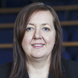 a woman smiling for the camera