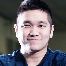 a young man wearing a blue shirt