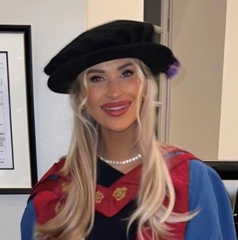 Female lecturer wearing academic robes