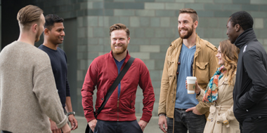a group of people standing in front of a building