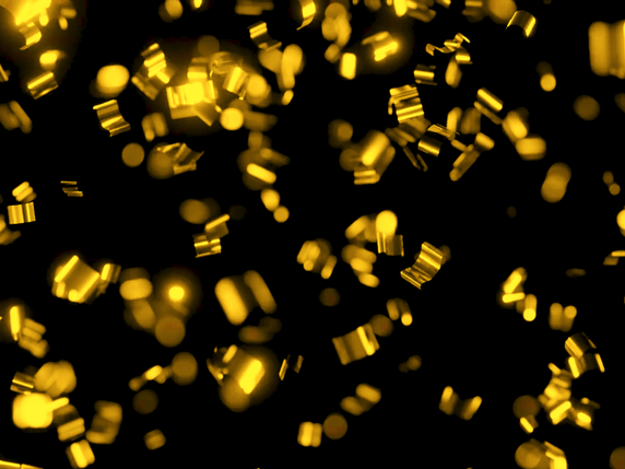 Gold confetti falling on a black background
