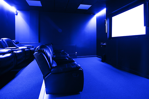 a flat screen tv sitting in a dark room