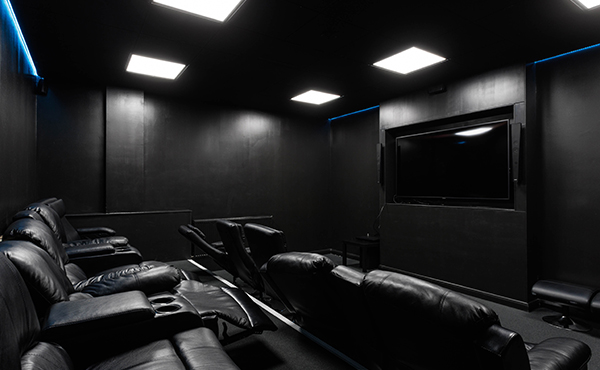 Trinity Square on-site cinema room with reclining chairs and PlayStation