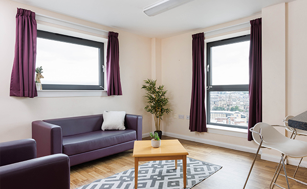 Trinity Square flat living and seating area including sofas and coffee table.