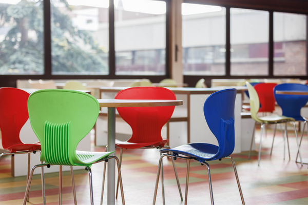 Bright chairs and tables in dining hall.