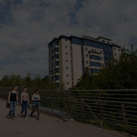 a group of people walking through a cloudy sky