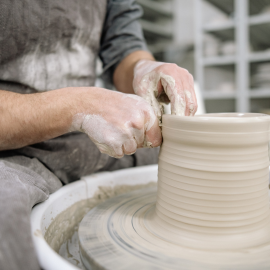 hands moulding pottery