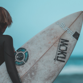 person holding a surf board