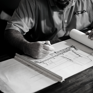 Person looking at a construction sketch.