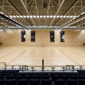 Large sports hall, looking over seated balcony. 