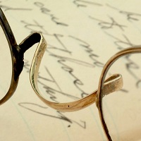 Image of wire spectacles and writing