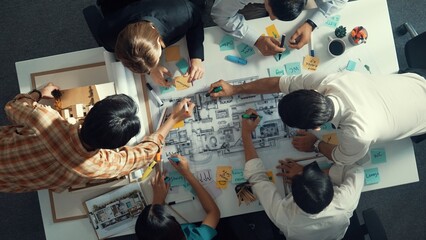 People Sitting Around a Table working on a plan