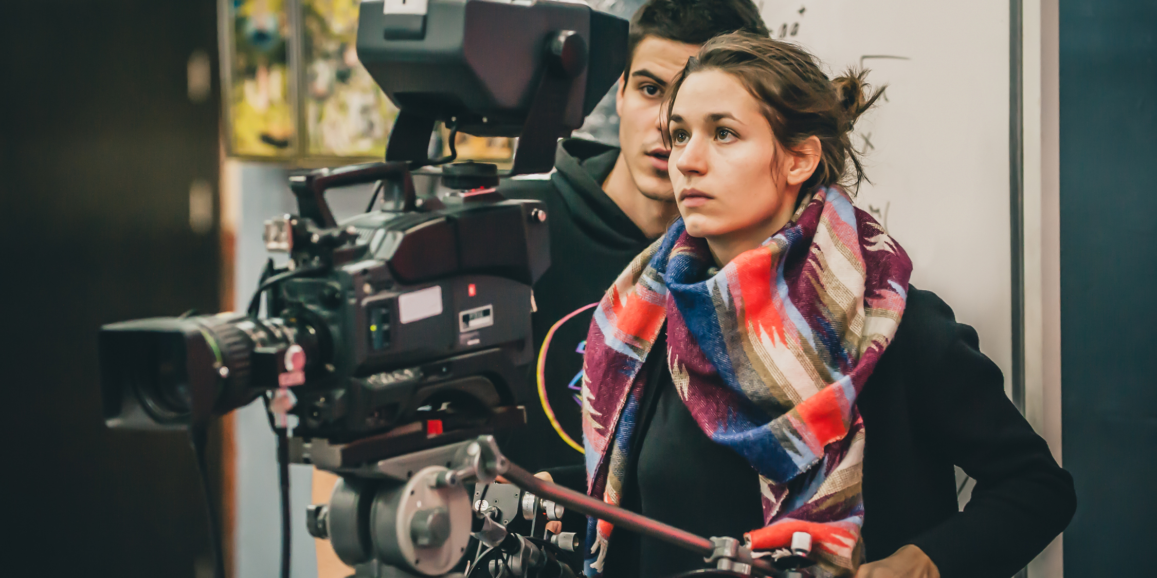 Male and Female using a film camera