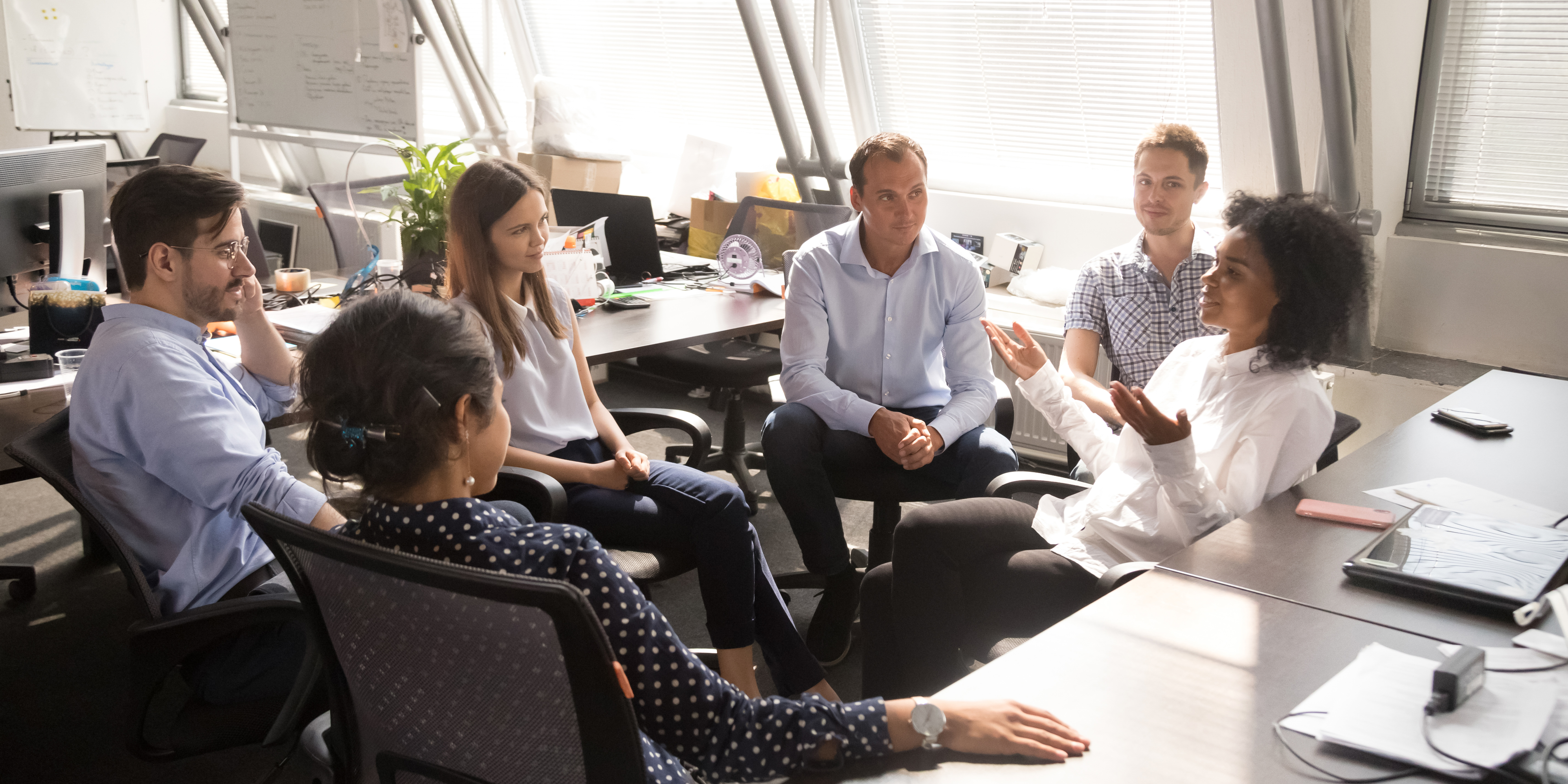 People Sitting at desks having a meeting