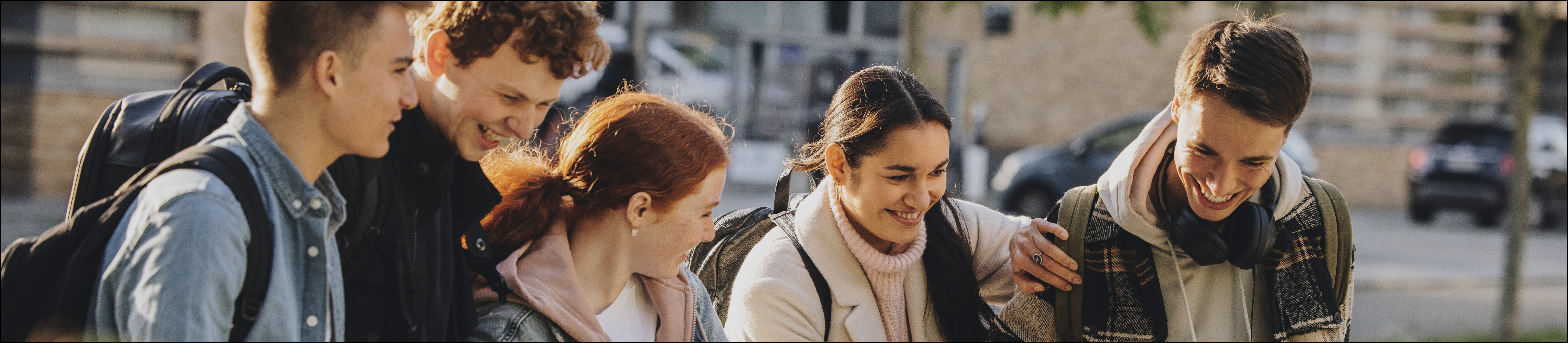 A group of students walking and laughing