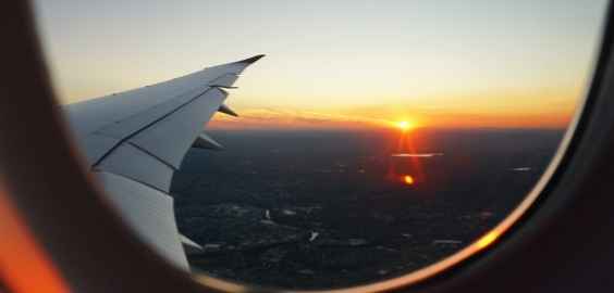view from airplane window at sunset