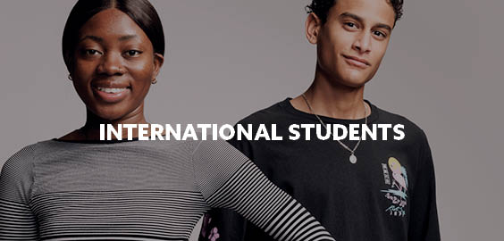 Two students smiling with text saying international students