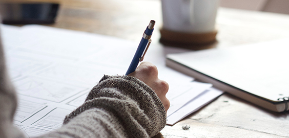 Hand on paper writing