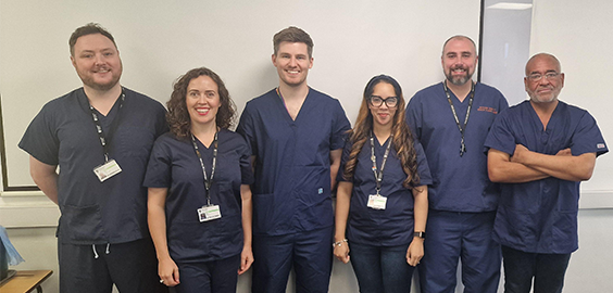 Operating Department Practice staff, wearing scrubs and smiling 