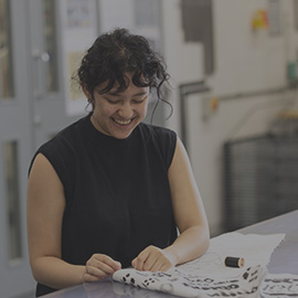 Student smiling in class.