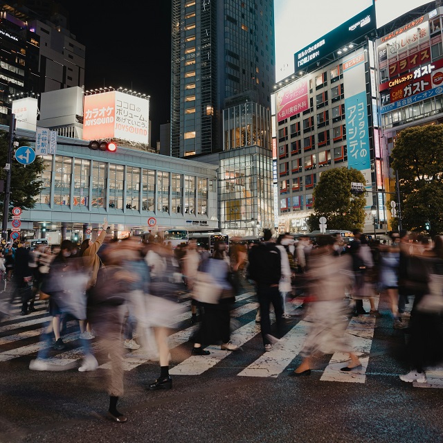 A blurred urban crowd