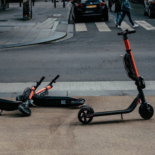 orange scooters in street