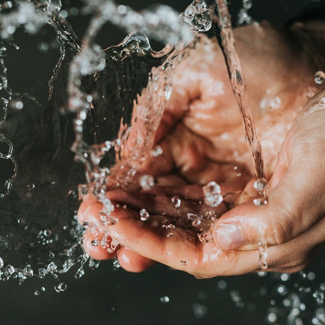 hands cupped collecting water