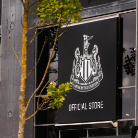 Newcastle United's Football Logo printed on a building shop front