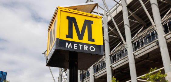 A street sign reads 'M' for 'Metro'